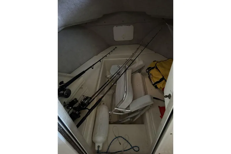Slide: The Image of Interior of 2006 Parker 2820 XL Sport Cabin with fishing rods and gear. - 8