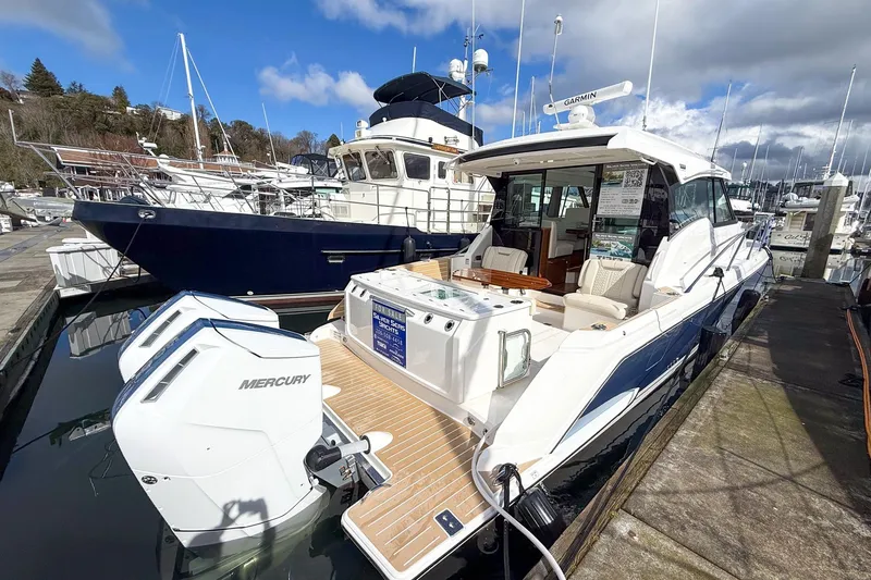 Slide: The Image of 2026 Tiara Yachts 43 LE docked, featuring Mercury engines and luxurious seating. - 11