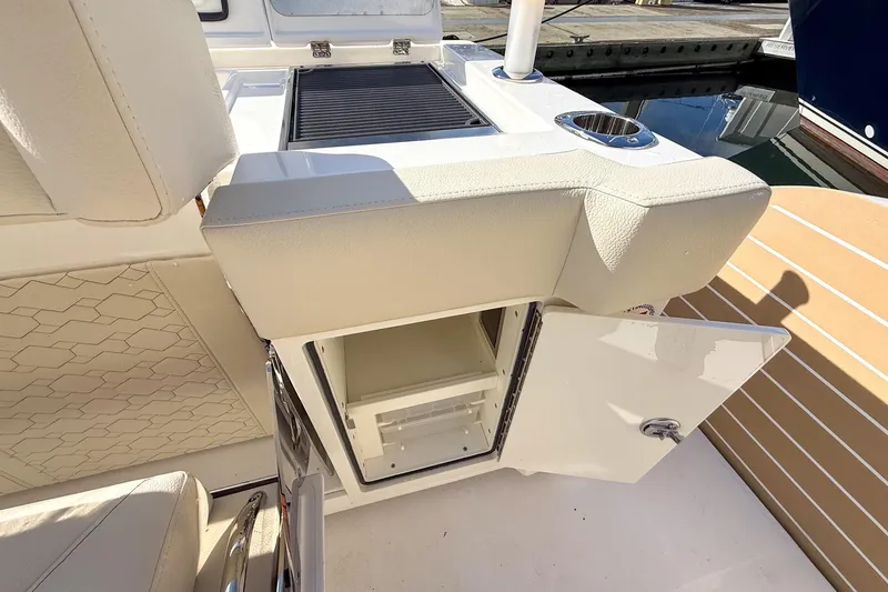 Slide: The Image of 2026 Tiara Yachts 43 LE interior with open storage compartment and seating. - 27