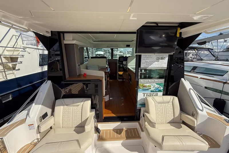 Slide: The Image of Luxury interior of 2026 Tiara Yachts 43 LE, featuring elegant seating and modern design. - 33