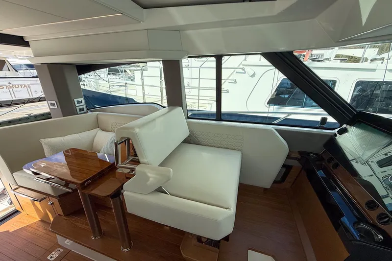 Slide: The Image of Luxurious interior of 2026 Tiara Yachts 43 LE with elegant seating and wooden table. - 40