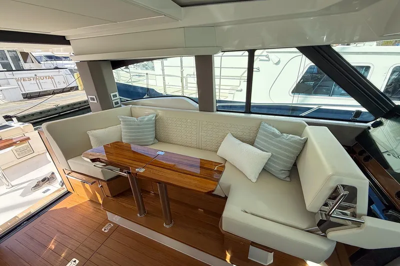 Slide: The Image of Luxurious interior of 2026 Tiara Yachts 43 LE with elegant seating and wooden table. - 41