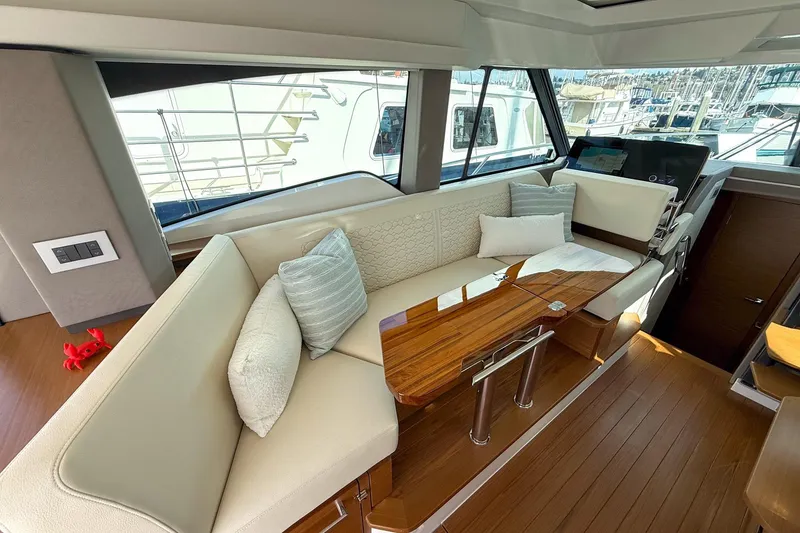 Slide: The Image of Luxurious interior of 2026 Tiara Yachts 43 LE with elegant seating and wooden table. - 42