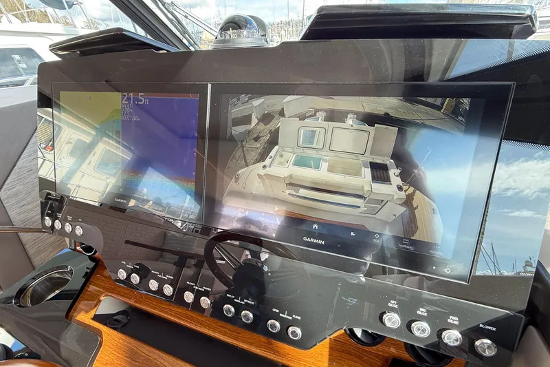 Slide: The Image of 2026 Tiara Yachts 43 LE dashboard with advanced Garmin navigation displays. - 44