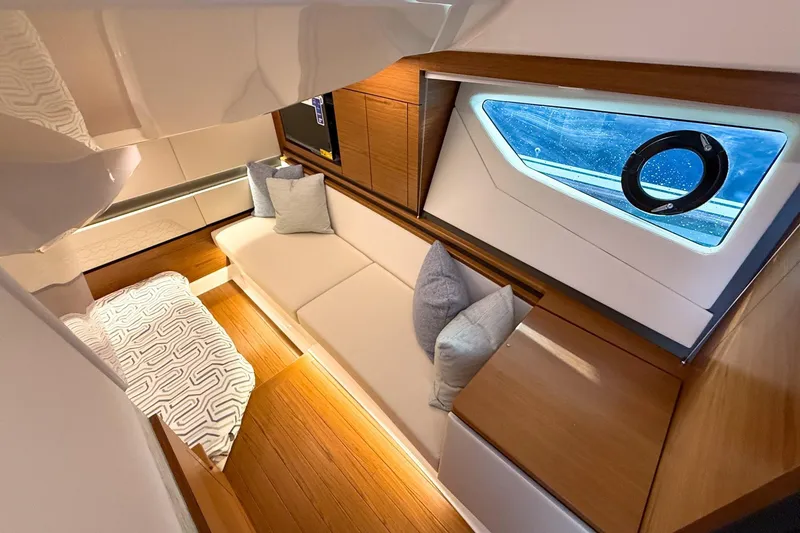 Slide: The Image of Luxurious interior of 2026 Tiara Yachts 43 LE with modern seating and elegant wood finishes. - 55