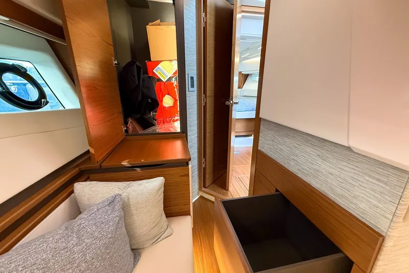 Slide: The Image of Luxurious interior of 2026 Tiara Yachts 43 LE, featuring elegant wood finishes and modern design. - 57