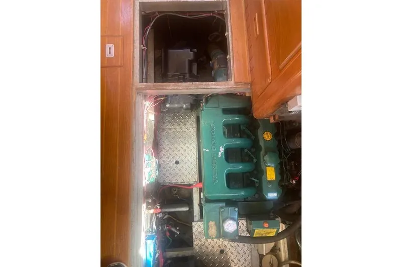 Slide: The Image of Engine compartment of 1985 Baba 40 Pilot House sailboat with visible Volvo Penta engine. - 37