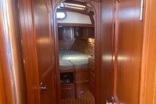 Slide: The Image of Control panel of a 1985 Baba 40 Pilot House sailboat with radio and switches. - 4