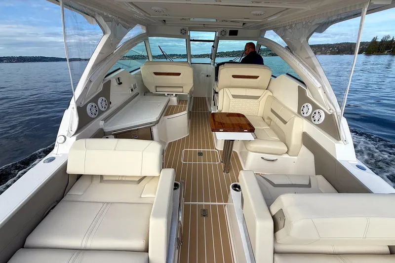 Slide: The Image of Luxurious 2026 Tiara Yachts 34 LX interior with elegant seating and wooden table on open water. - 24