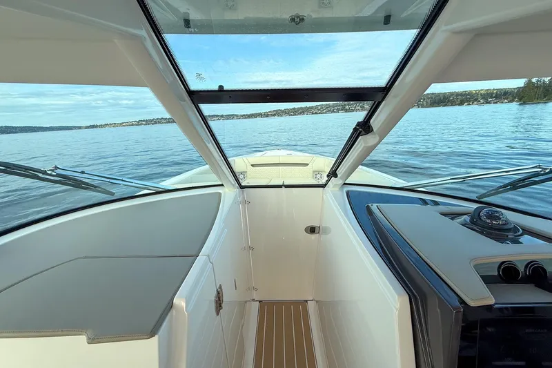 Slide: The Image of Interior view of 2026 Tiara Yachts 34 LX, showcasing sleek design and open water. - 28