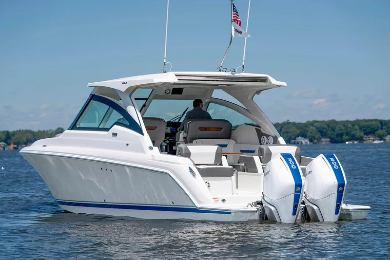 Slide: The Image of Manufacturer Provided Image: 2025 Tiara Yachts 34 LX boat on water with dual outboard engines. - 5