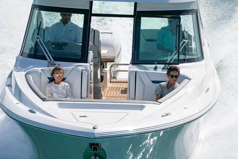 Slide: The Image of Manufacturer Provided Image: 2025 Tiara Yachts 34 LX cruising with passengers on a sunny day. - 6