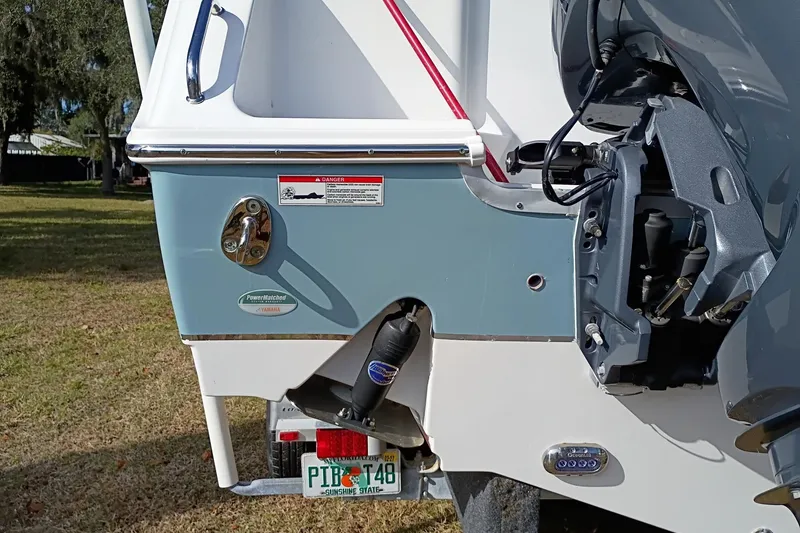 Slide: The Image of 2021 Sea Hunt Gamefish 27 Coffin Box boat with Yamaha engine, rear view. - 14