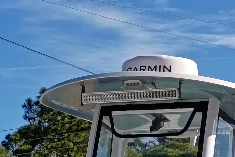 Slide: The Image of 2021 Sea Hunt Gamefish 27 Coffin Box boat with Garmin radar, clear sky background. - 16
