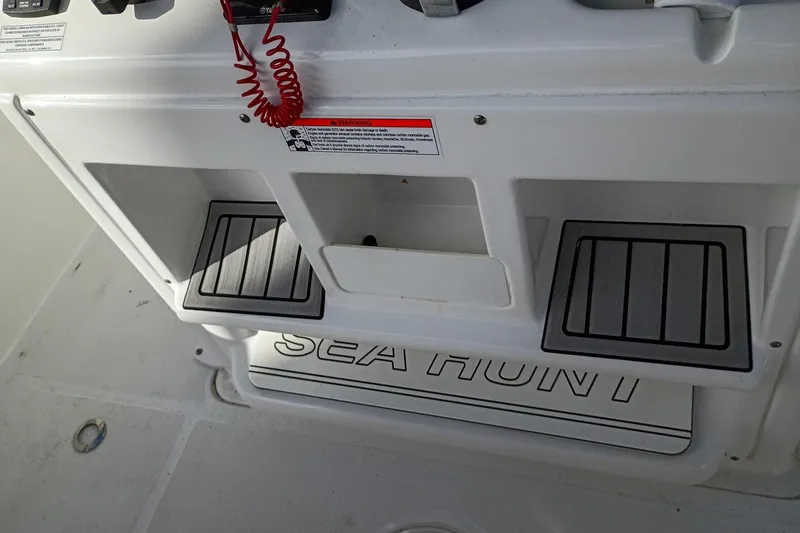 Slide: The Image of 2021 Sea Hunt Gamefish 27 Coffin Box boat console with storage compartments. - 32