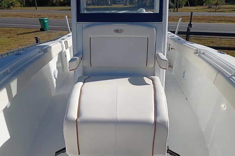 Slide: The Image of 2021 Sea Hunt Gamefish 27 Coffin Box boat interior with white seating. - 37