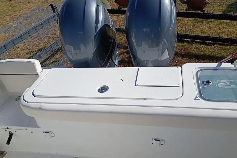 Slide: The Image of 2021 Sea Hunt Gamefish 27 Coffin Box boat with dual outboard motors. - 40