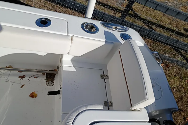 Slide: The Image of 2021 Sea Hunt Gamefish 27 Coffin Box interior with white seating and cup holders. - 44
