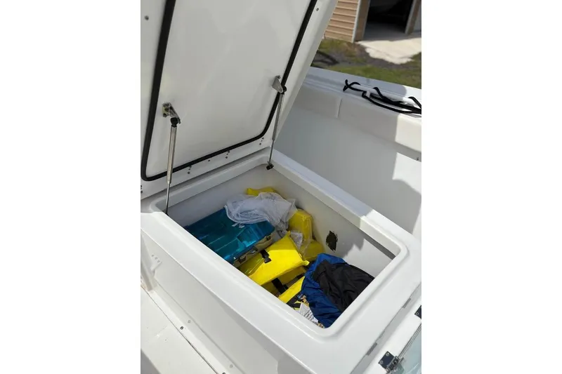 Slide: The Image of Open storage compartment on 2021 Sea Hunt Gamefish 27 Coffin Box boat. - 9