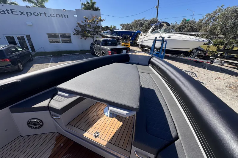 Slide: The Image of 2025 Skipper-BSK 38NC boat with sleek deck design in a marina setting. - 15