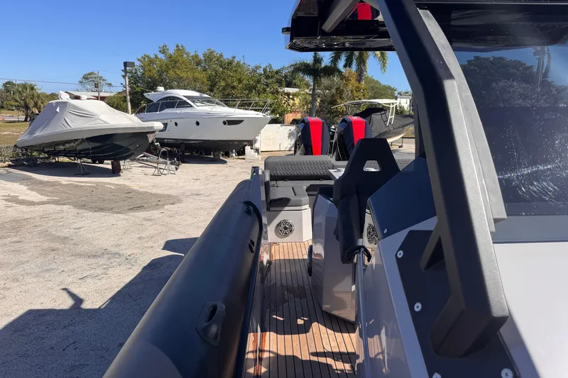 Slide: The Image of 2025 Skipper-BSK 38NC boat in a marina with other vessels. - 20