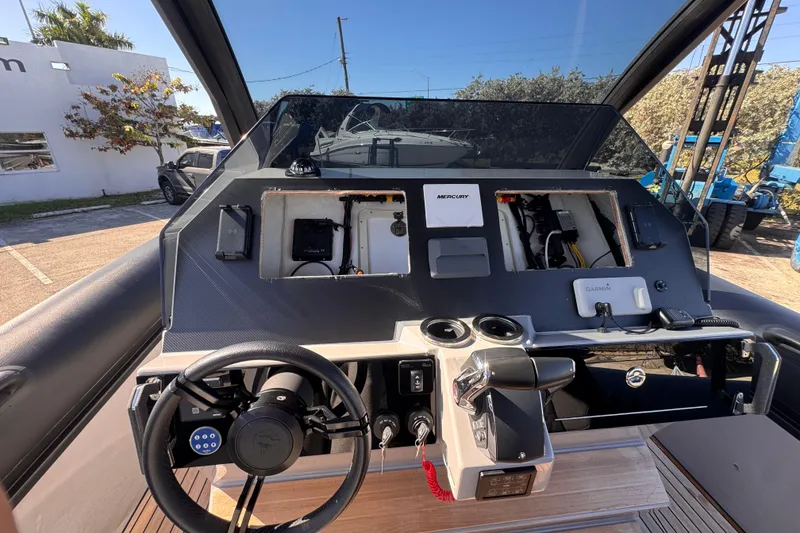 Slide: The Image of Cockpit of 2025 Skipper-BSK 38NC boat with steering wheel and control panel. - 21