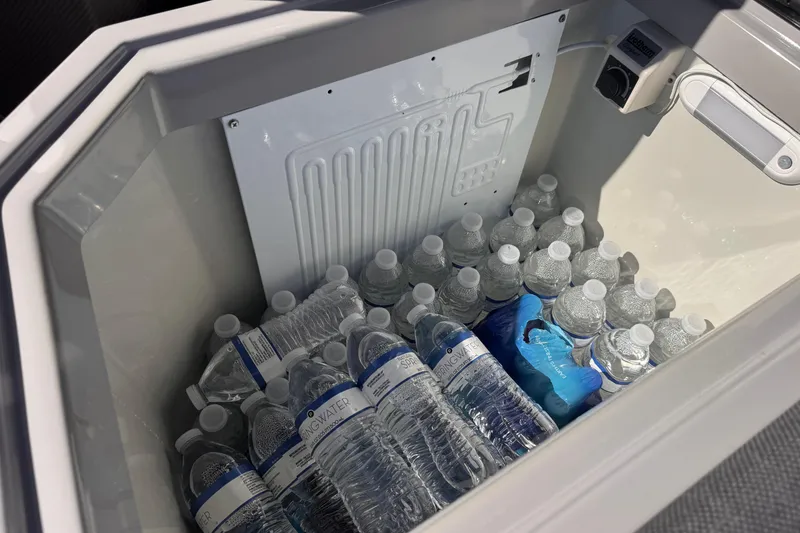 Slide: The Image of Cooler filled with bottled water inside Skipper-BSK 38NC, 2025 model. - 22