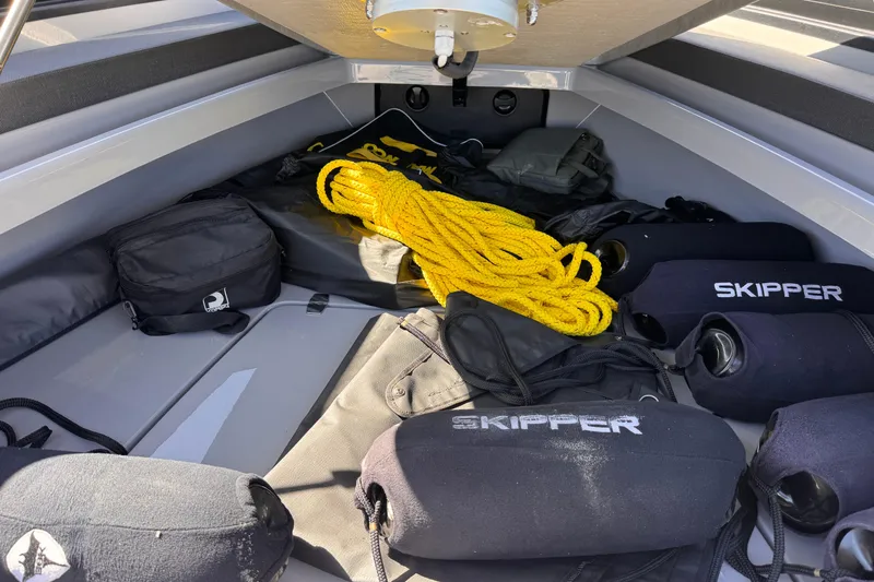 Slide: The Image of Interior of 2025 Skipper-BSK 38NC boat with equipment and yellow rope. - 27