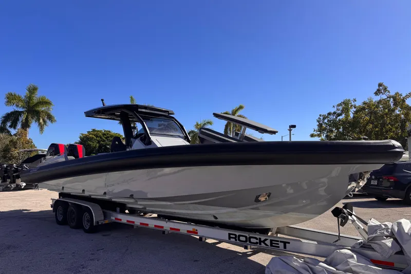 Slide: The Image of 2025 Skipper-BSK 38NC boat on trailer under clear blue sky. - 28