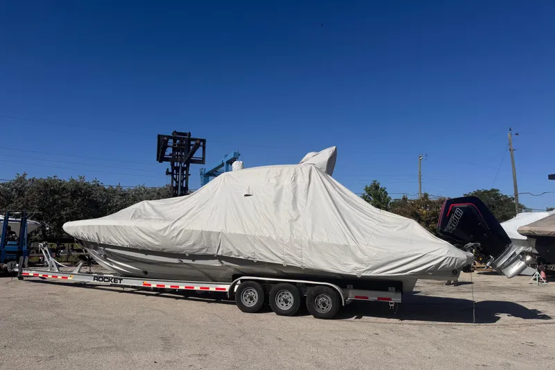 Slide: The Image of Covered 2025 Skipper-BSK 38NC boat on trailer under clear blue sky. - 29