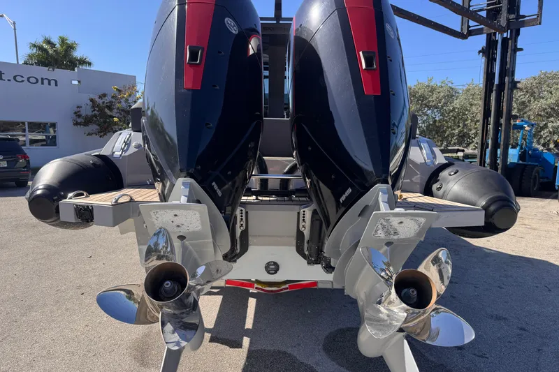 Slide: The Image of Twin outboard engines on a 2025 Skipper-BSK 38NC boat, showcasing propellers. - 4