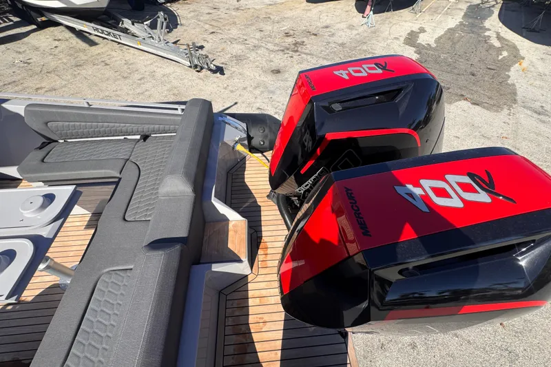 Slide: The Image of 2025 Skipper-BSK 38NC boat with dual Mercury 400R engines and sleek seating. - 6