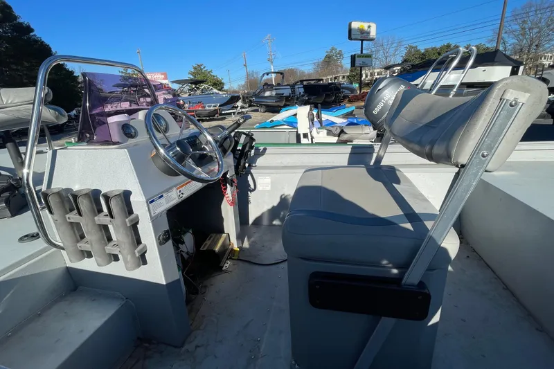 Slide: The Image of 2021 G3 Gator Tough 17 CCJ DLX boat interior with steering wheel and seating. - 11