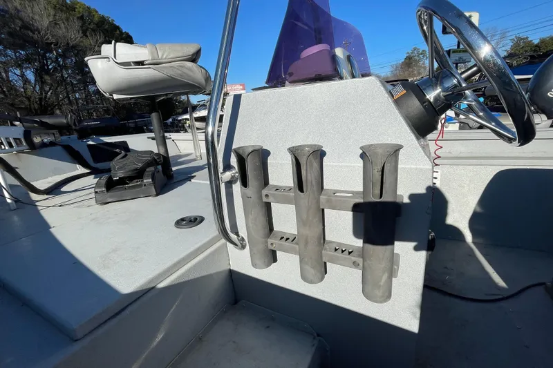 Slide: The Image of 2021 G3 Gator Tough 17 CCJ DLX boat console with rod holders and steering wheel. - 13