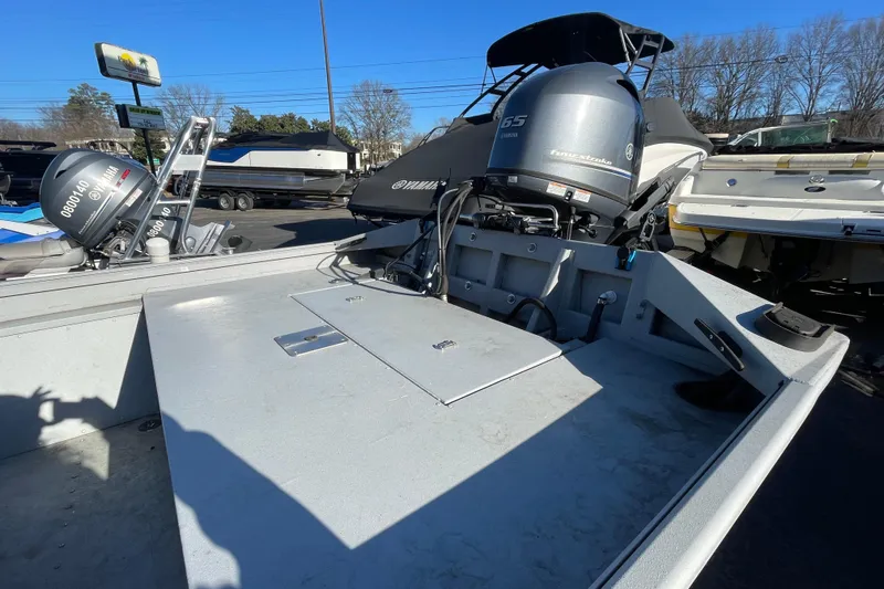 Slide: The Image of 2021 G3 Gator Tough 17 CCJ DLX boat with Yamaha outboard motor in a parking lot. - 15