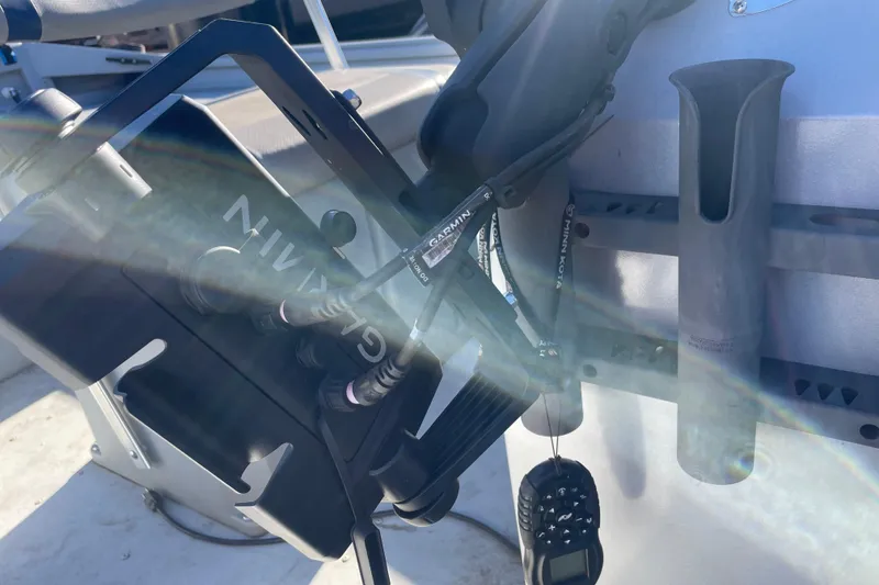 Slide: The Image of 2021 G3 Gator Tough 17 CCJ DLX boat console with Garmin equipment and rod holder. - 16