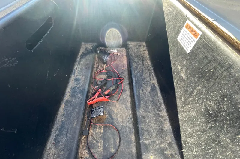 Slide: The Image of Interior of 2021 G3 Gator Tough 17 CCJ DLX boat with jumper cables. - 18