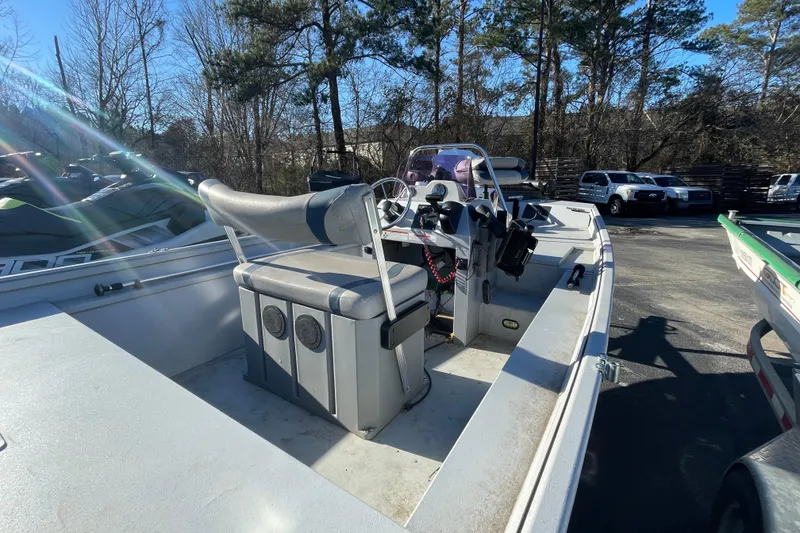 Slide: The Image of 2021 G3 Gator Tough 17 CCJ DLX boat with console and seating, parked outdoors. - 8