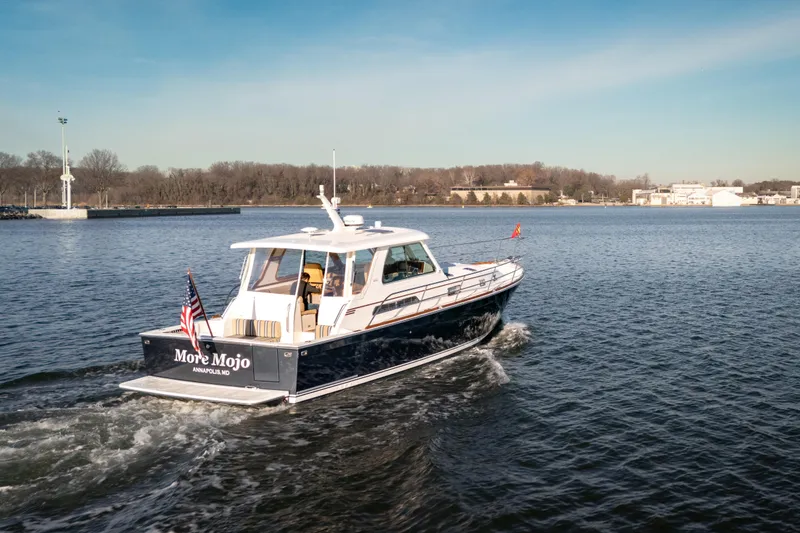 The Image of 2009 Sabre 42 Hard Top Express cruising on a calm river near Annapolis. - 0