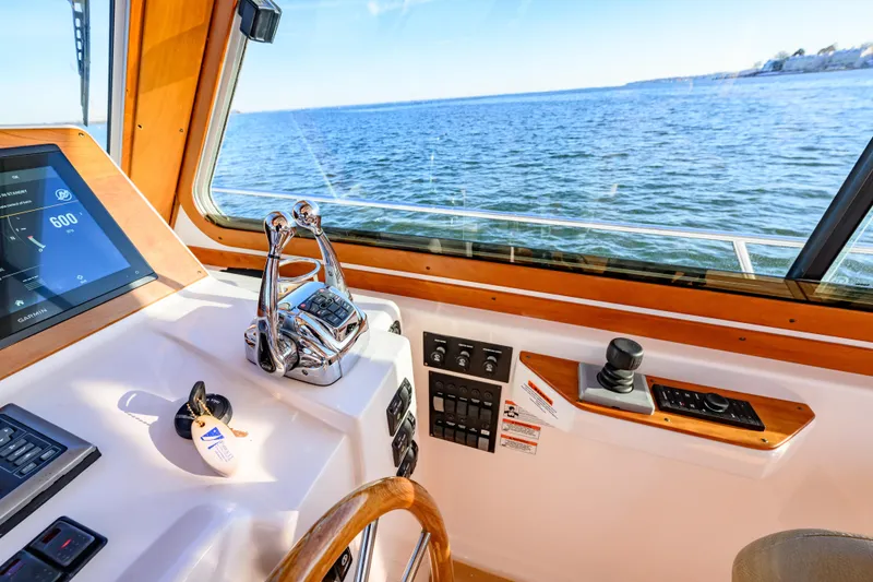 Slide: The Image of 2009 Sabre 42 Hard Top Express helm with navigation controls and ocean view. - 12