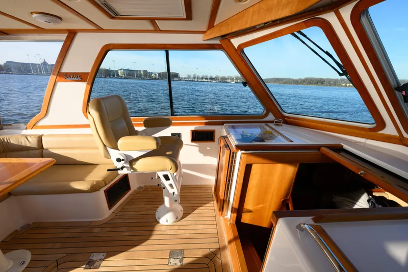 Slide: The Image of 2009 Sabre 42 Hard Top Express interior with leather seating and scenic water view. - 17