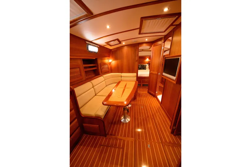 Slide: The Image of Luxurious interior of 2009 Sabre 42 Hard Top Express yacht with wood finish and seating area. - 25