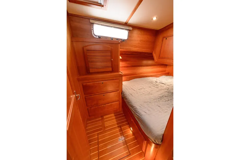 Slide: The Image of 2009 Sabre 42 Hard Top Express cabin with wooden interior and cozy bed. - 33
