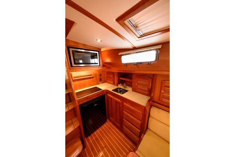 Slide: The Image of Luxurious wooden interior of 2009 Sabre 42 Hard Top Express yacht kitchen area. - 36
