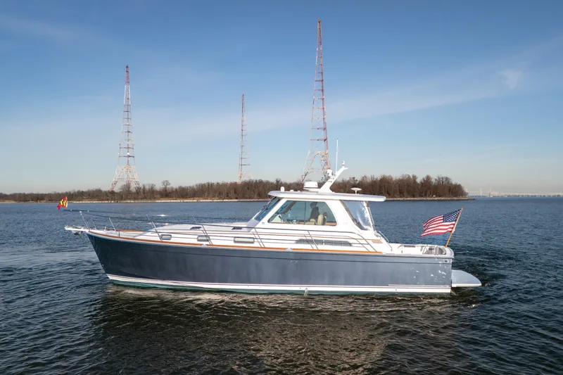Slide: The Image of 2009 Sabre 42 Hard Top Express yacht cruising on open water. - 4