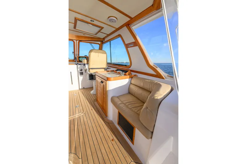 Slide: The Image of Interior of 2009 Sabre 42 Hard Top Express yacht with seating and ocean view. - 7