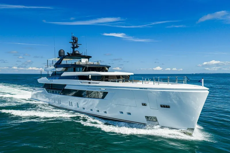 The Image of Luxurious 2020 Sanlorenzo 44 Alloy yacht cruising on open sea under clear blue sky. - 0