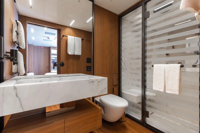 Slide: The Image of Luxurious interior of 2020 Sanlorenzo 44 Alloy yacht with modern wooden design and elegant staircase. - 30