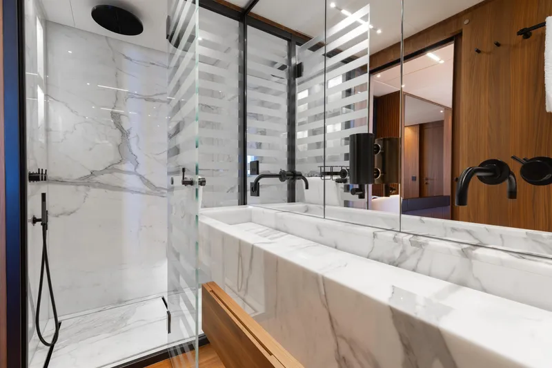 Slide: The Image of Luxurious bedroom interior on 2020 Sanlorenzo 44 Alloy yacht with modern design and wood accents. - 36