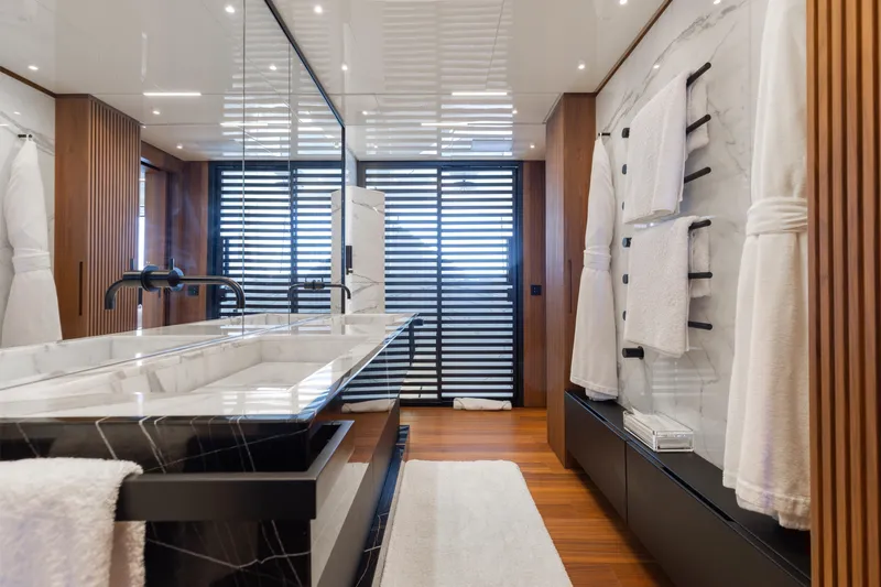 Slide: The Image of Luxurious 2020 Sanlorenzo 44 Alloy yacht illuminated on serene ocean waters. - 60